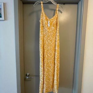 Yellow floral maxi dress with adjustable straps and smocked back